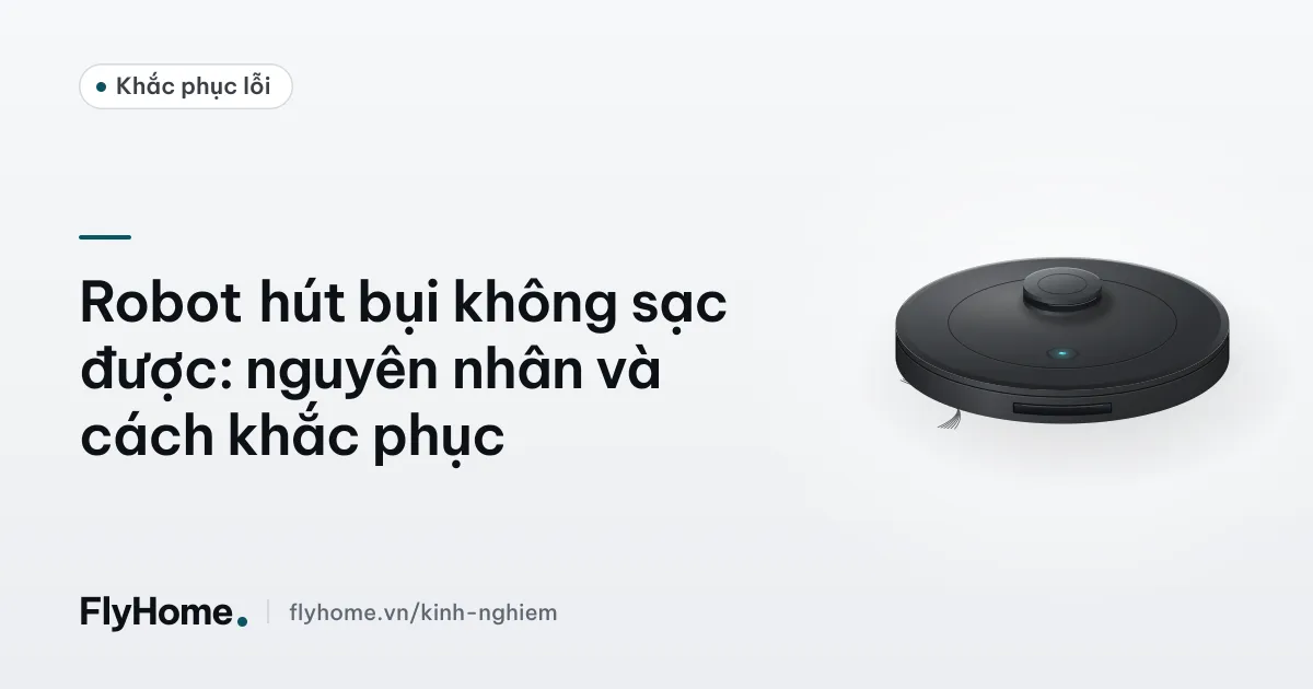 Robot hút bụi đỗ trên đế sạc, cận cảnh hai tiếp điểm sạc kim loại dưới gầm máy